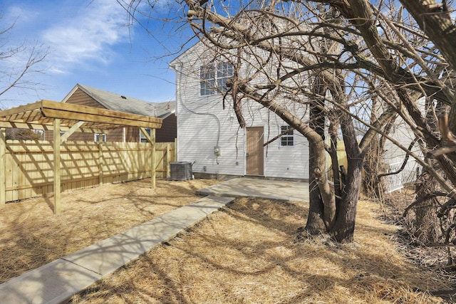 exterior space featuring central AC unit and a patio