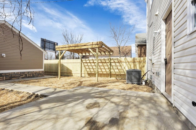 view of patio with cooling unit and a pergola