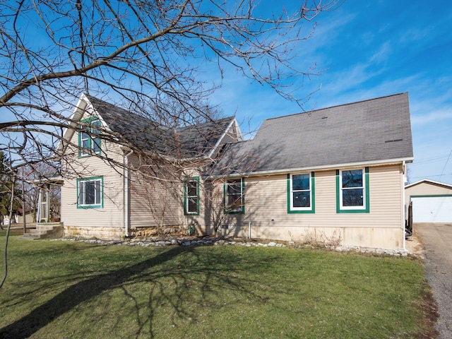 view of front of property with a garage and a front yard