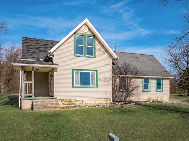 back of house featuring a lawn