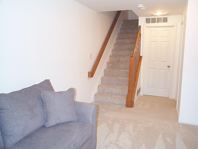 stairs featuring carpet floors and visible vents