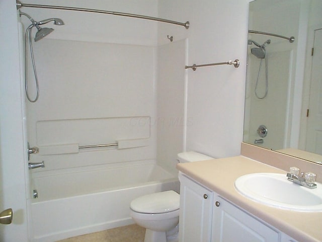 bathroom featuring vanity, toilet, and shower / bathtub combination