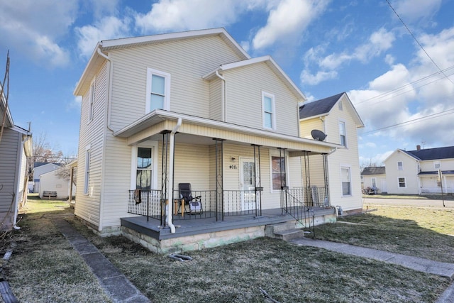 view of front of house with a front lawn and covered porch