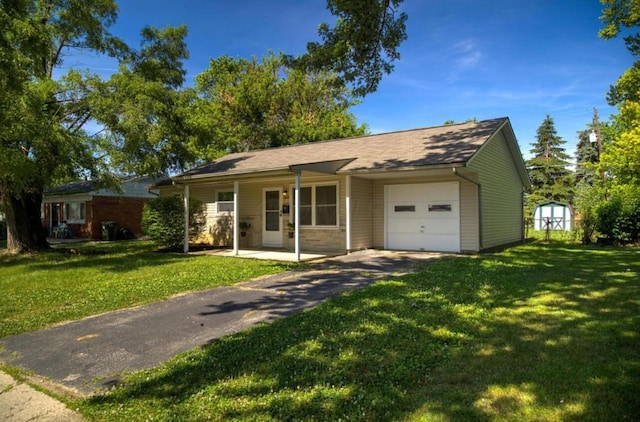 ranch-style home with a garage, driveway, and a front yard