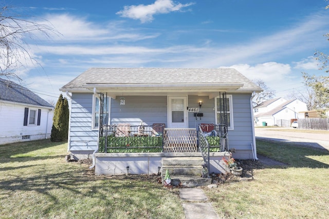 bungalow-style home with a porch and a front yard