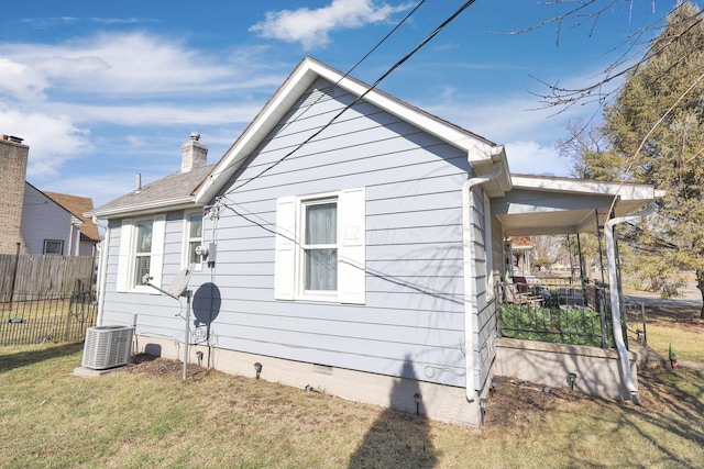4461 Lancaster Ave, Columbus, OH 43207 - view of home's exterior featuring central AC and a lawn