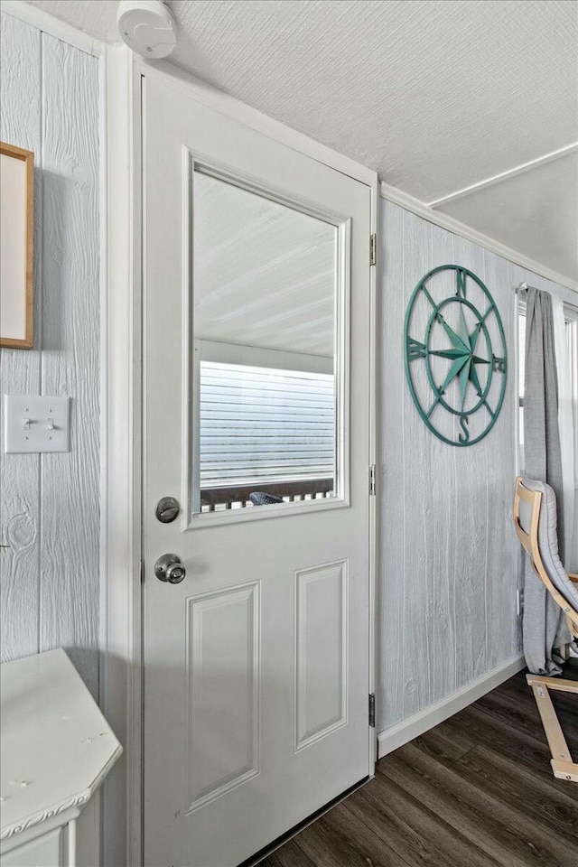 doorway to outside with a healthy amount of sunlight and dark hardwood / wood-style flooring