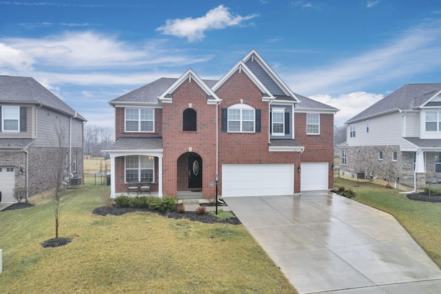 view of front of property featuring a garage and a front lawn