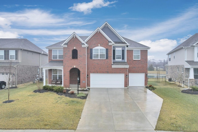 view of front of home featuring a garage and a front lawn