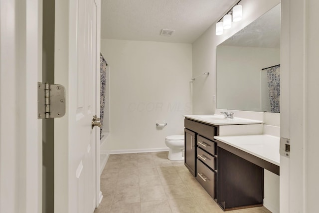 full bathroom with tile patterned floors, toilet, a textured ceiling, vanity, and shower / bathtub combination with curtain