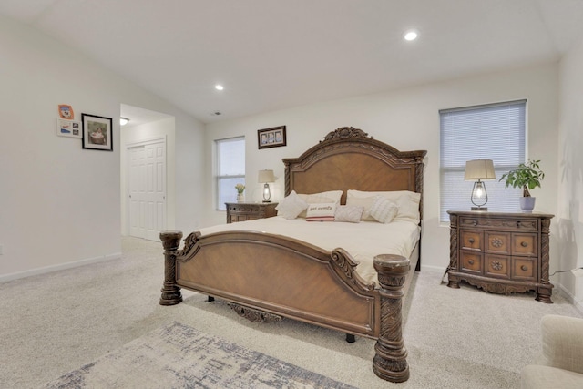 carpeted bedroom with vaulted ceiling