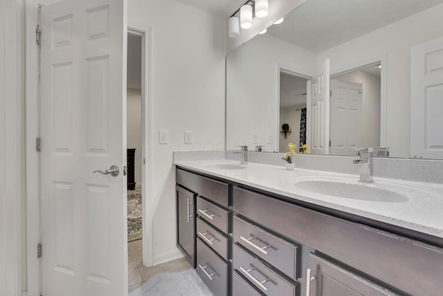 bathroom with vanity and tile patterned floors