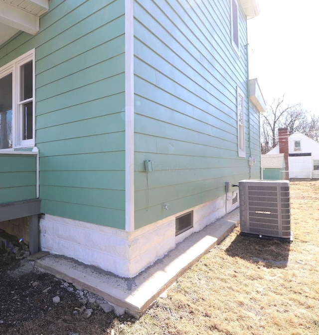 view of side of home featuring cooling unit