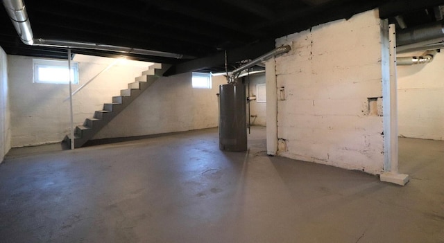 basement featuring gas water heater and plenty of natural light