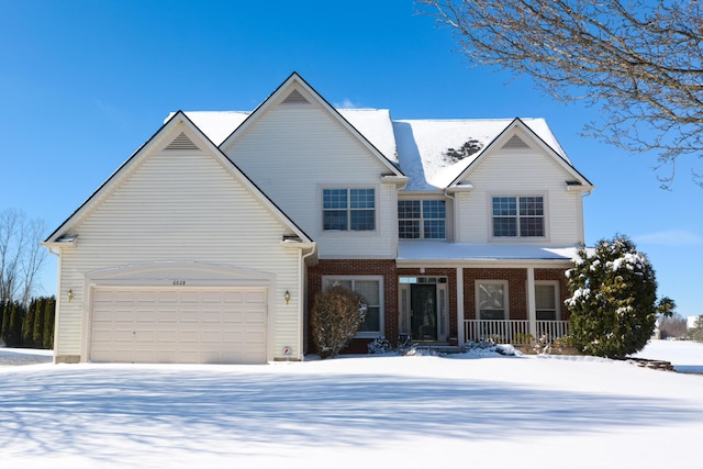 view of front of house with covered porch and a garage