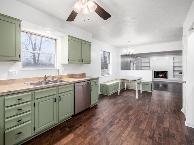 kitchen with dark hardwood / wood-style flooring, sink, dishwasher, and green cabinets