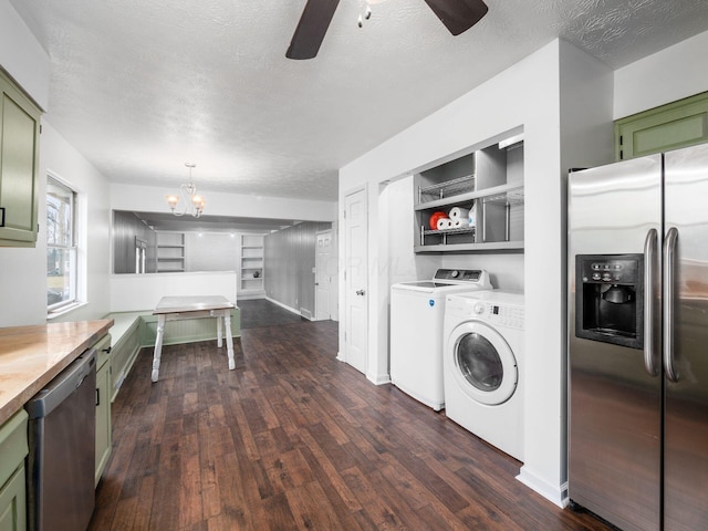 kitchen featuring appliances with stainless steel finishes, dark wood-type flooring, a textured ceiling, and green cabinetry