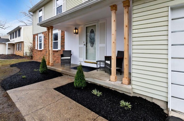 view of exterior entry with covered porch