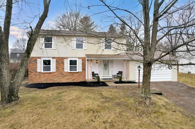 view of front of house with a garage and a front yard