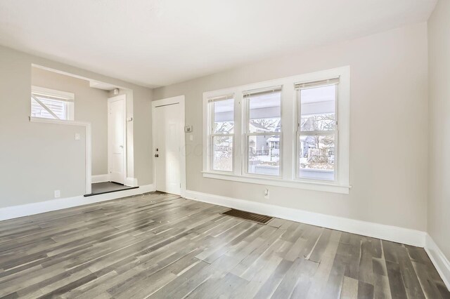 1437 Manchester Ave, Columbus, OH 43211 - unfurnished living room with baseboards and wood finished floors