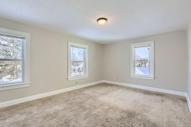 1437 Manchester Ave, Columbus, OH 43211 - empty room featuring plenty of natural light, carpet flooring, and baseboards