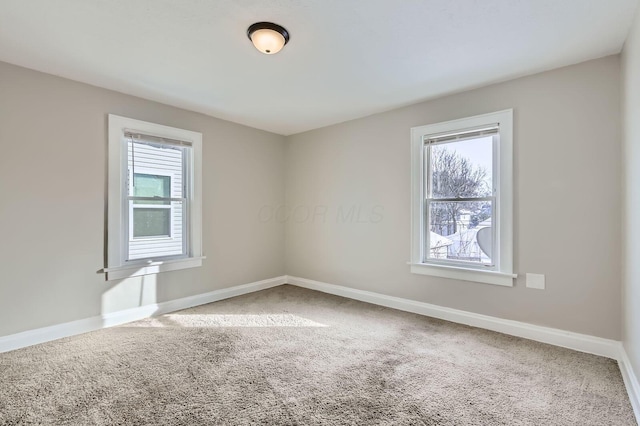 1437 Manchester Ave, Columbus, OH 43211 - spare room featuring carpet flooring and baseboards
