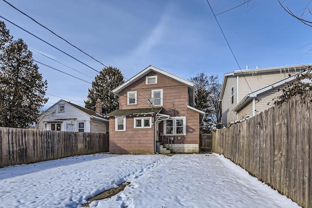 1437 Manchester Ave, Columbus, OH 43211 - snow covered back of property with a fenced backyard and entry steps