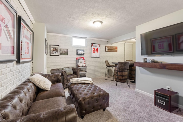 living room with brick wall, light carpet, and a textured ceiling