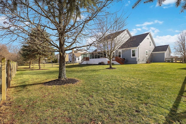 view of yard featuring a sunroom