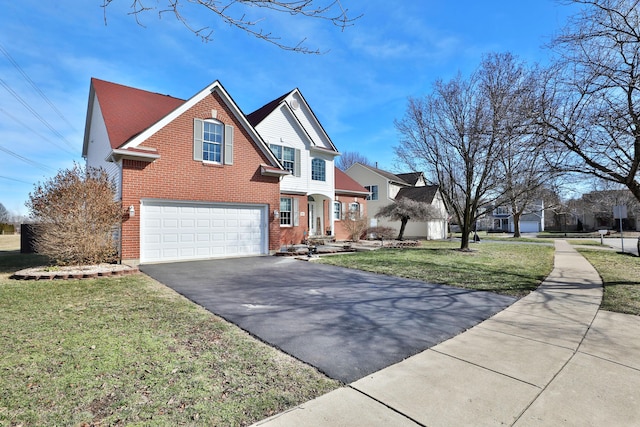 view of front of home featuring a garage and a front yard