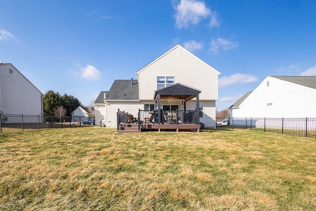 back of property featuring a yard and a deck