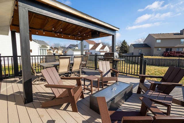 deck with a gazebo and area for grilling