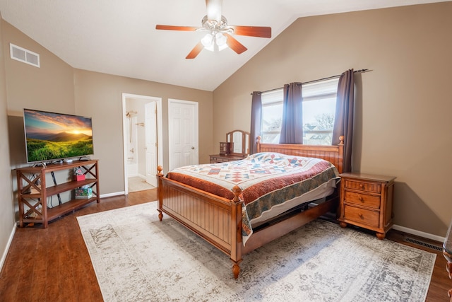 bedroom featuring vaulted ceiling, ensuite bathroom, ceiling fan, and dark hardwood / wood-style flooring