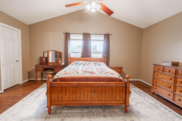 bedroom with wood-type flooring, vaulted ceiling, and ceiling fan