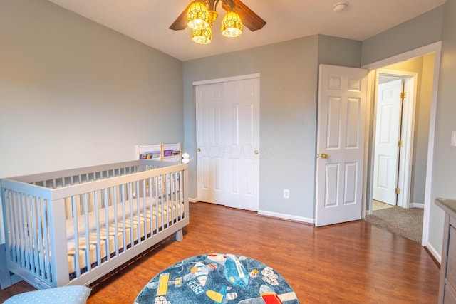 bedroom featuring ceiling fan, hardwood / wood-style floors, and a closet