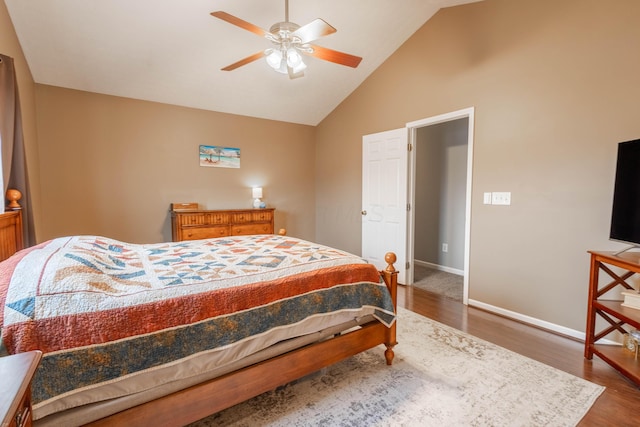 bedroom featuring dark hardwood / wood-style flooring, high vaulted ceiling, and ceiling fan