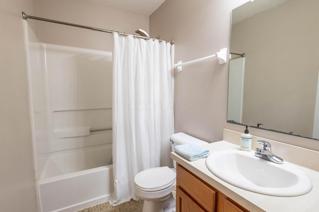 full bathroom featuring vanity, toilet, shower / bath combo with shower curtain, and a textured ceiling