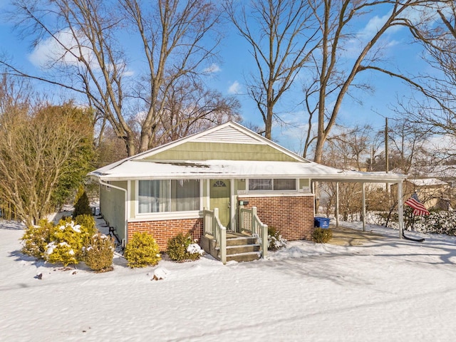 view of front of property featuring a carport