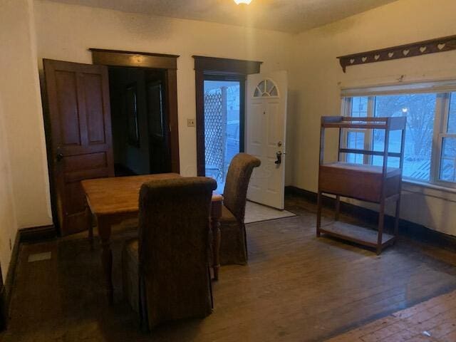 dining area featuring dark hardwood / wood-style flooring