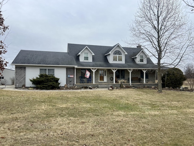 cape cod-style house featuring a front lawn and a porch