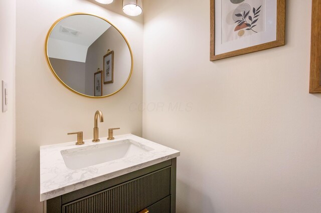 bathroom with vanity and visible vents