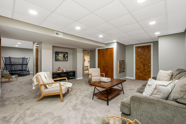 living room with light carpet, a paneled ceiling, visible vents, baseboards, and recessed lighting
