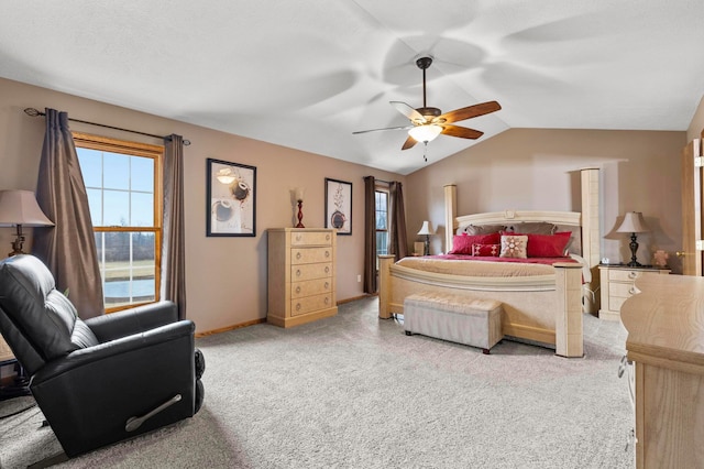 carpeted bedroom featuring ceiling fan and lofted ceiling