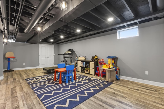 playroom with wood-type flooring