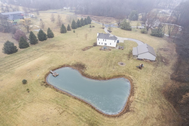 drone / aerial view with a water view and a rural view