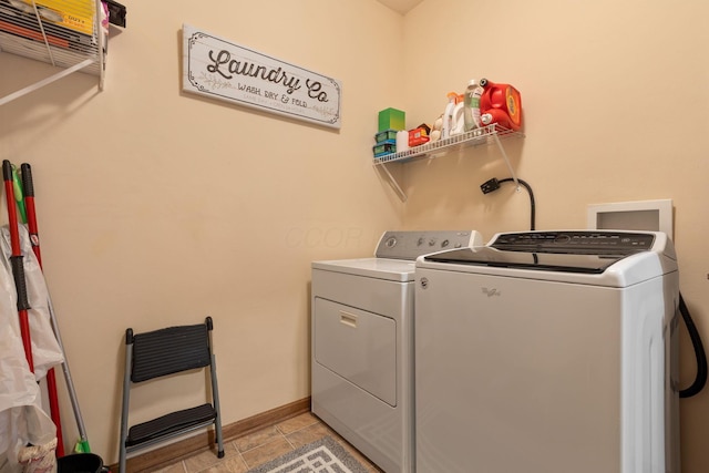 laundry room with independent washer and dryer