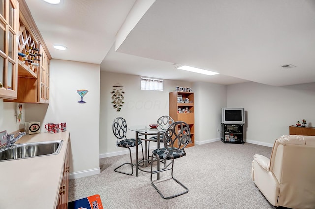 dining space with visible vents, baseboards, and light colored carpet