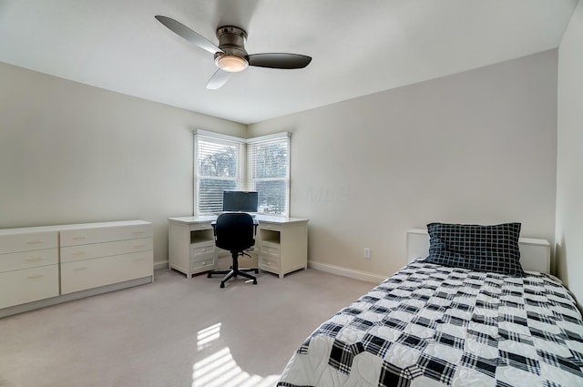 bedroom featuring ceiling fan, baseboards, and light carpet