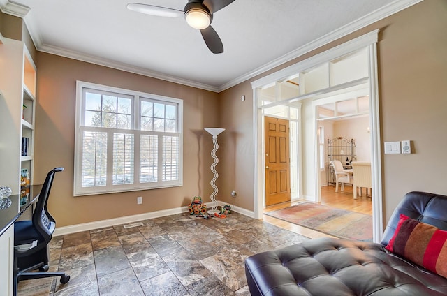 office area with ceiling fan, crown molding, baseboards, and stone finish flooring