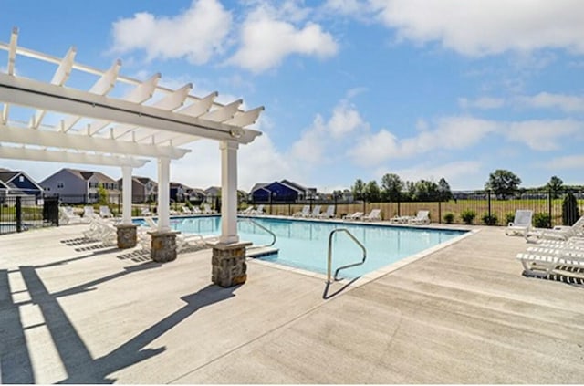 view of pool featuring a patio area and a pergola